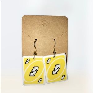 Yellow uno reverse earrings non-tarnish.